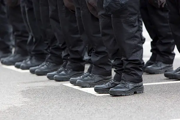 Photo of Policemen legs and boots