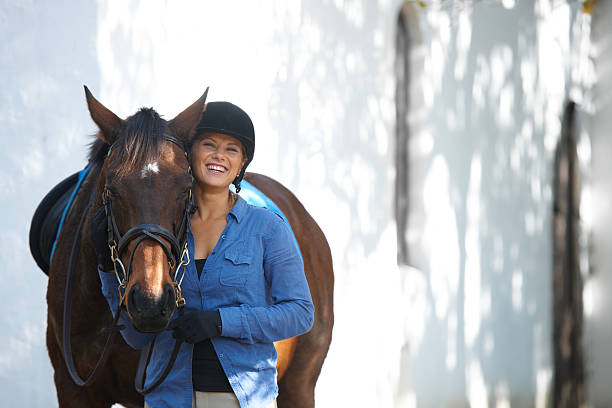 A happy young woman standing outside with her horsehttp://195.154.178.81/DATA/shoots/ic_781040.jpg