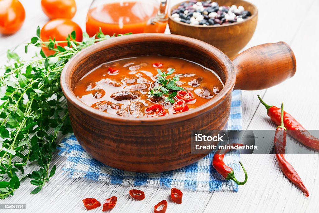 Chili soup with red beans and greens Chili soup with red beans and greens. Mexican cuisine Bean Stock Photo