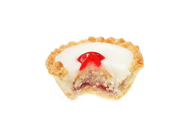 Cherry bakewell tart with slice cut out