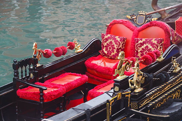 istock Golden figurines and red chairs 526069771