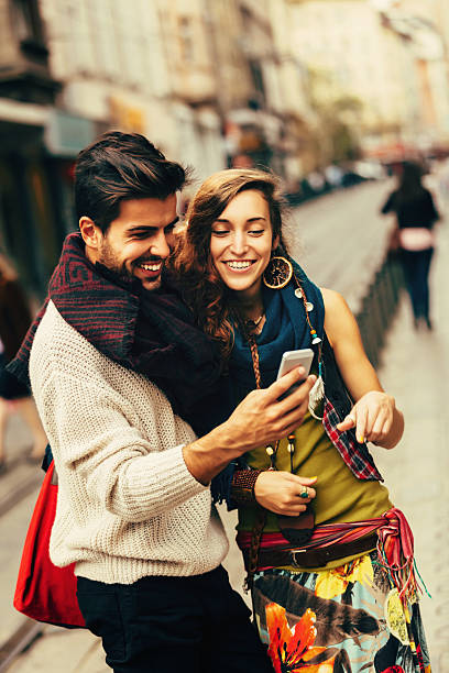 istock Happy friends surfing the net 526069773