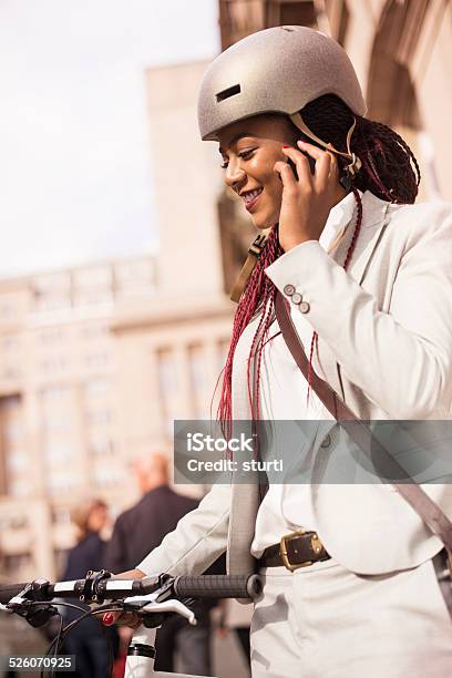 Keeping In Touch On The Way To Work Stock Photo - Download Image Now - Bicycle, Helmet, Women