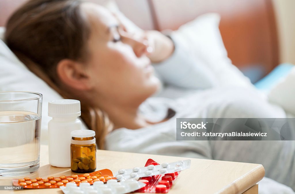 Sick woman sleeping in bedroom Horizontal view of sick woman sleeping in bedroom Adult Stock Photo