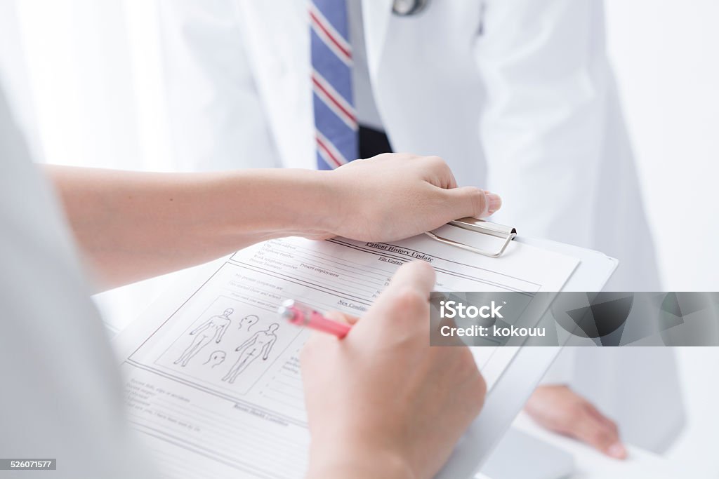 Nurse to fill in the chart Ring Binder Stock Photo