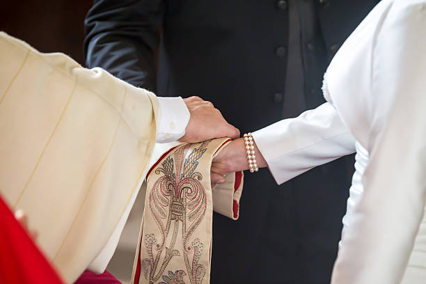 istock Priest giving blessing to a couple at a wedding ceremony 526072241