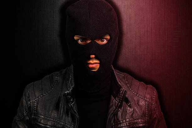istock portrait of a scary thief 526073705