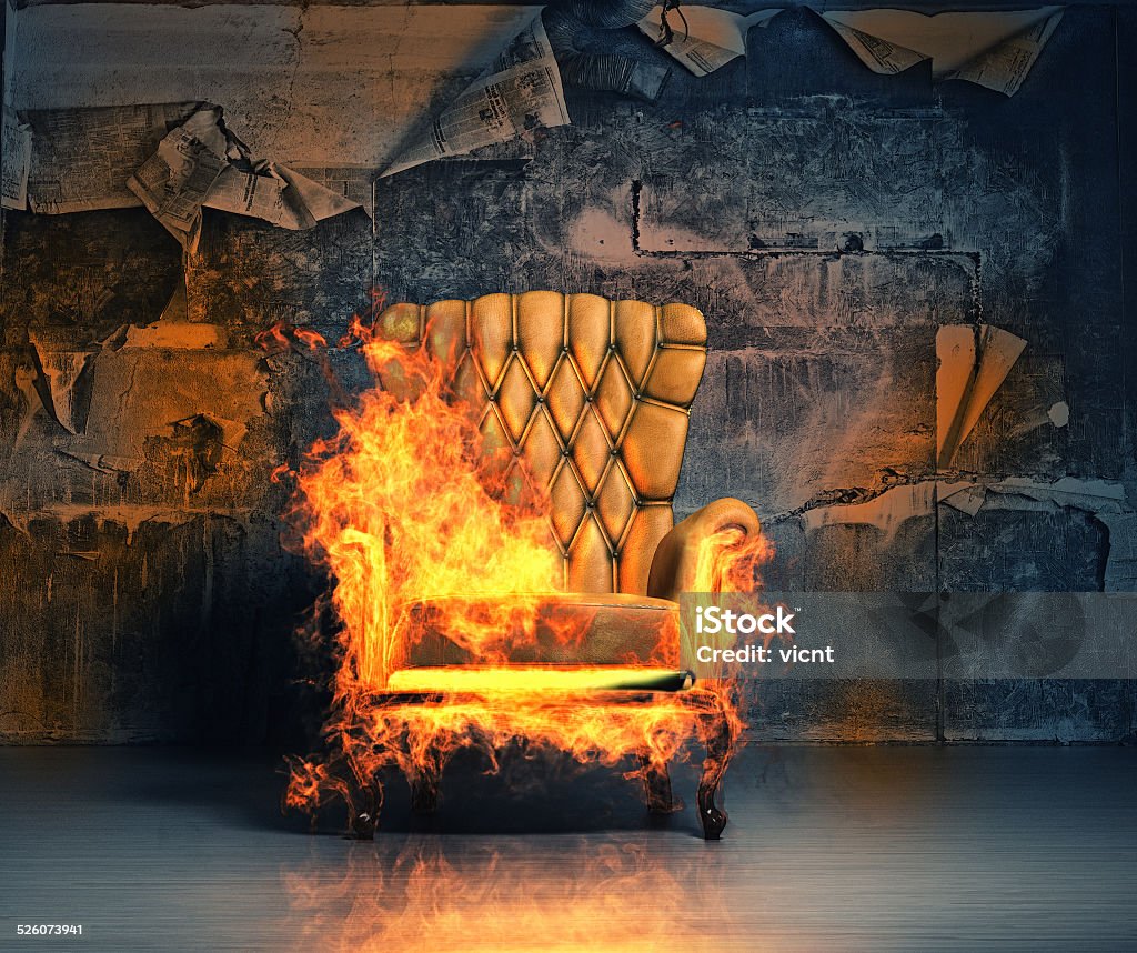 burning armchair burning armchair in the grunge interior. 3D illustration creative concept Heat - Temperature Stock Photo
