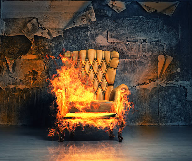 burning armchair burning armchair in the grunge interior. 3D illustration creative concept burning house stock pictures, royalty-free photos & images