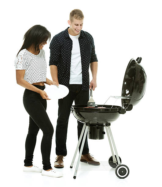 istock Couple together by the barbecue grill 526075191