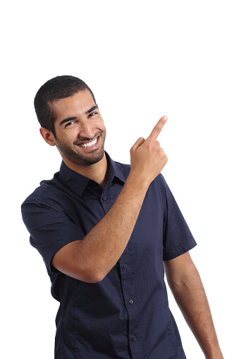 Arab promoter man presenting while pointing at side isolated on a white background