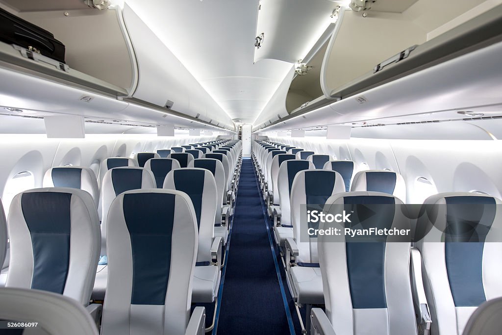 Commercial Passenger Aircraft Cabin Interior of a large empty commercial passenger aircraft. Airplane Stock Photo