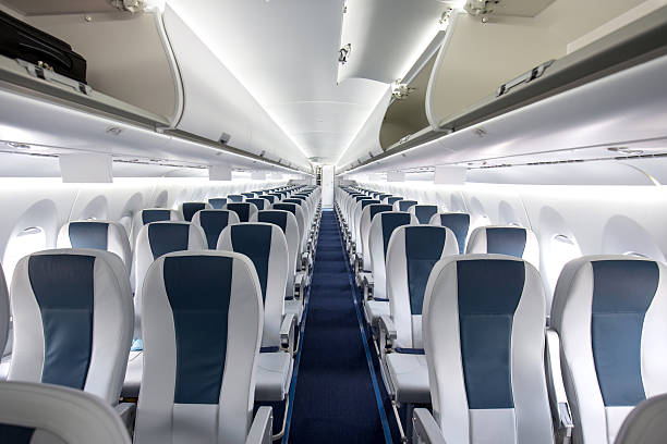 Commercial Passenger Aircraft Cabin Interior of a large empty commercial passenger aircraft. airplane interior stock pictures, royalty-free photos & images