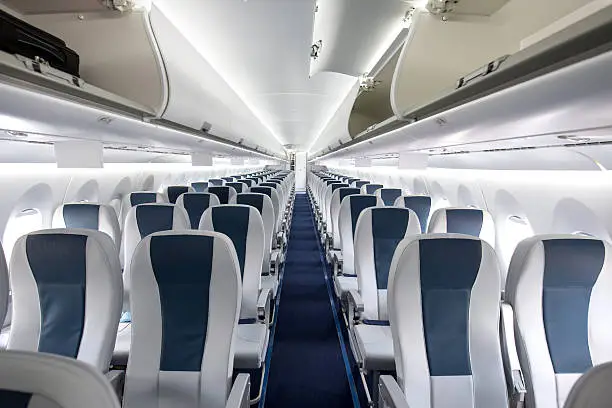 Interior of a large empty commercial passenger aircraft.
