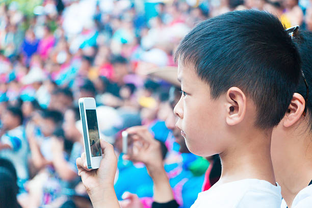 istock mother use smart phone to take photo 526086485
