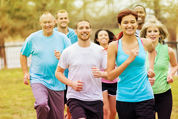 istock Diverse adults exercising with running club group 526086925