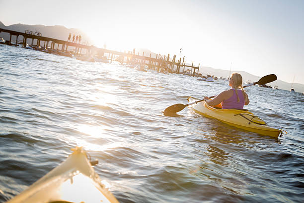 istock Woman Kayaking on Beautiful Mountain Lake. 526089881