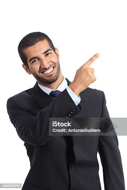 Arab Business Man Presenter Presenting And Pointing At Side Stock Photo - Download Image Now