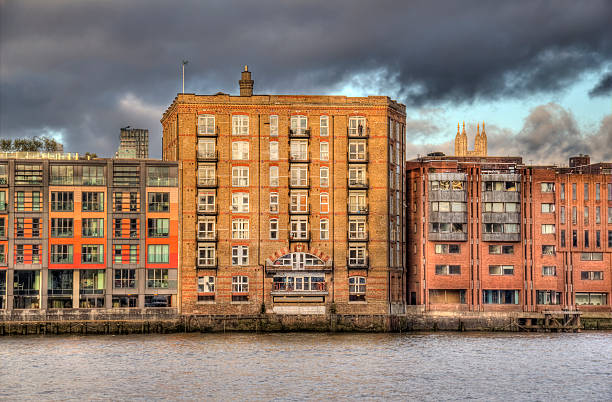 Historical warehouse converted into luxury apartments on the Thames in London, UK