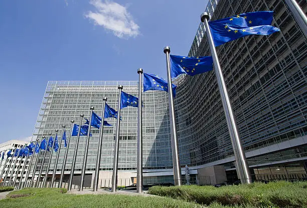 European Union flags in front of the Berlaymont building in Brussels, Belgium