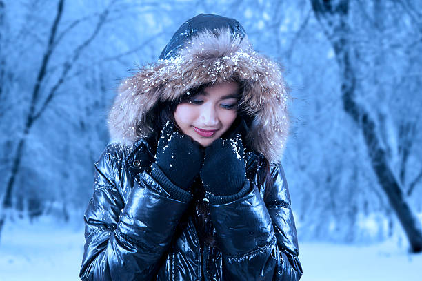 istock Gorgeous asian woman in winter park 526092073