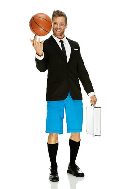 istock Smiling businessman holding basketball & briefcase 526093129