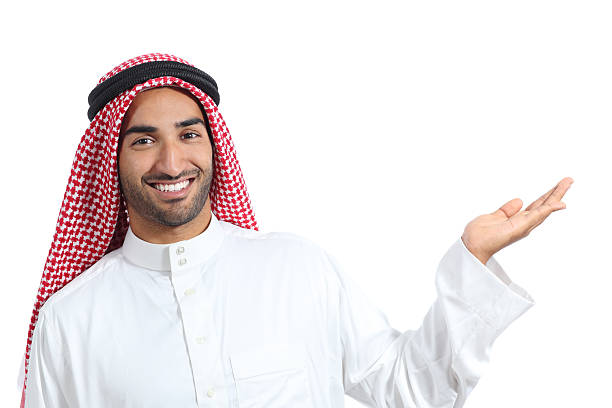 istock Arab saudi promoter man presenting a blank product 526093195