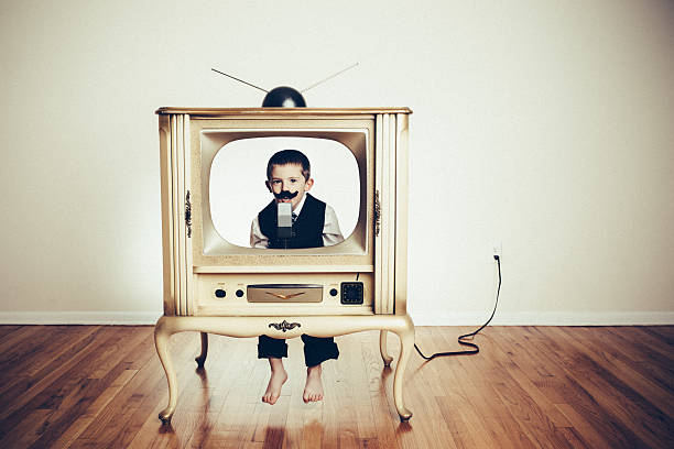 istock Preschool Child Playing Anchorman in Old TV 526093243