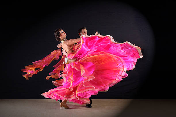 istock dancers in ballroom isolated on black background 526109737