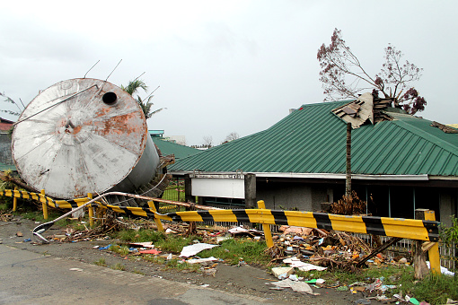 Photograph image of a big water tank hit by a strong during a super typhoon Yolanda (Haiyan) in Tacloban, Philippines.