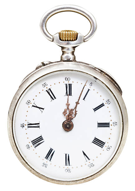 istock twelve o'clock and five min on dial of retro watch 526112891