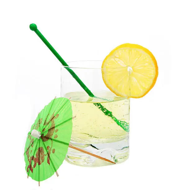 Fizzy drink in tumbler with umbrella