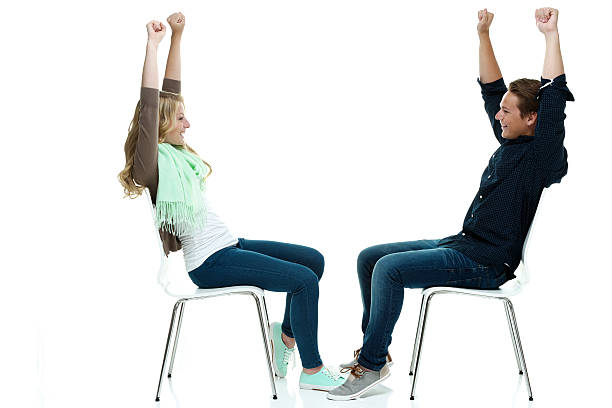 istock Cheerful couple on chair & cheering 526116593
