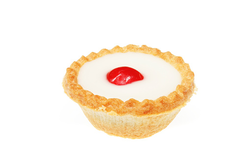 Iced cherry bakewell tart isolated on white