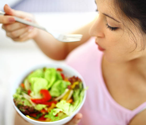 istock Woman enjoying salad. 526117031