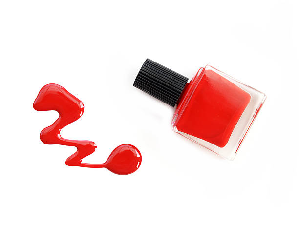 istock red nail polish bottle with splatters isolated on white background 526128336