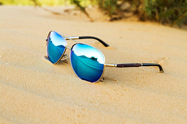 istock Sunglasses on the sand in the desert. 526130196
