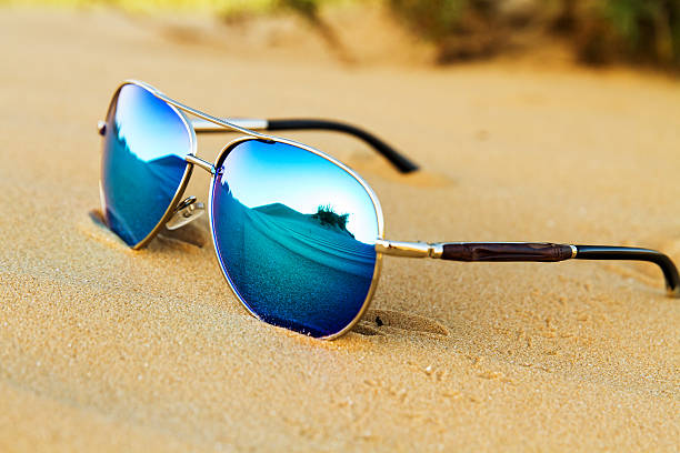 istock Sunglasses on the sand in the desert. 526130216