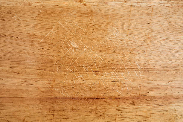 Old scratched wooden cutting board texture stock photo