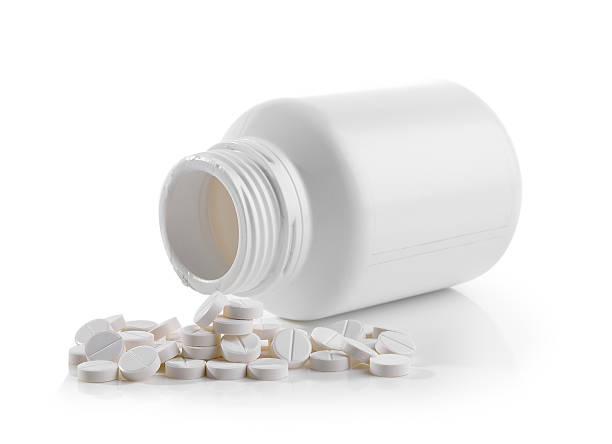istock Pills spilling out of pill bottle 526131628