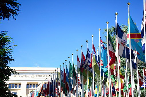 Geneva, Switzerland - June 2, 2015: The Allée des Nations, with the flags of the member countries at  the second-largest of the four major office sites of the United Nations