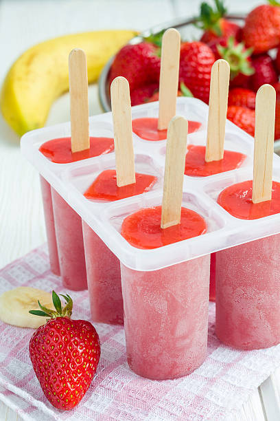 istock Homemade popsicles with strawberry and banana, vertical 526132658