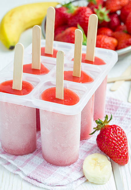 istock Homemade popsicles with strawberry and banana, vertical 526132666