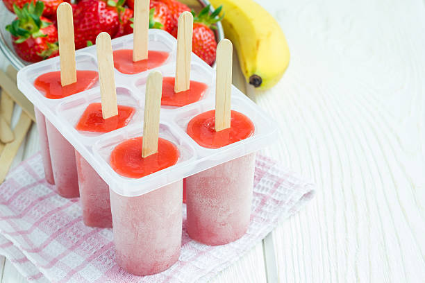 istock Homemade popsicles with strawberry and banana, copy space 526132674