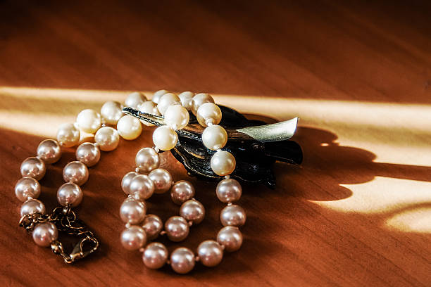 istock Pearl beads lying on the table and photographed close 526132914
