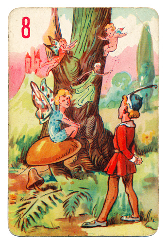 This is a Peter Pan playing card from British manufacturer Pepys with an illustration dating from 1939. Originally issued with green backs, this card is from a 1950s re-issue with red backs. The illustration shows Tinker Bell sitting on a toadstool with Peter Pan nearby.