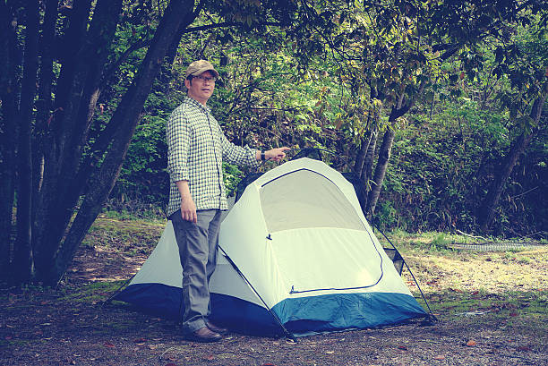 istock Man standing near the tent 526134174