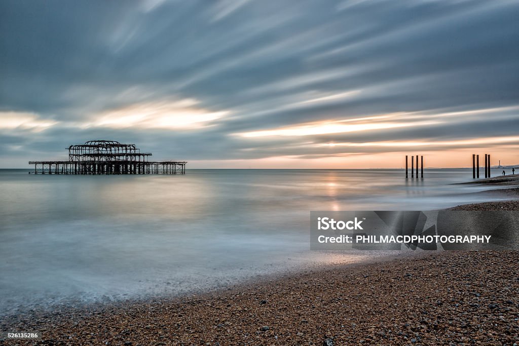 The old West Pier, Brighton The West Pier is a pier in Brighton, England. It was designed by Eugenius Birch, opening in 1866 and closing in 1975. The pier was the first to be Grade I listed in Britain but has become increasingly derelict since closure Brighton - England Stock Photo