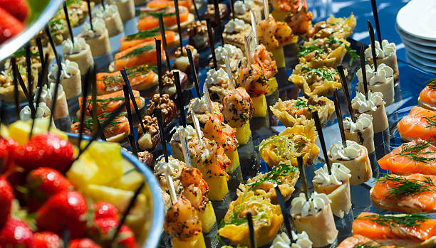 istock meat, fish, vegetable canapes on a festive wedding table outdoor 526135368