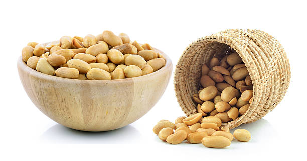 istock peanuts in the basket on white background 526135544